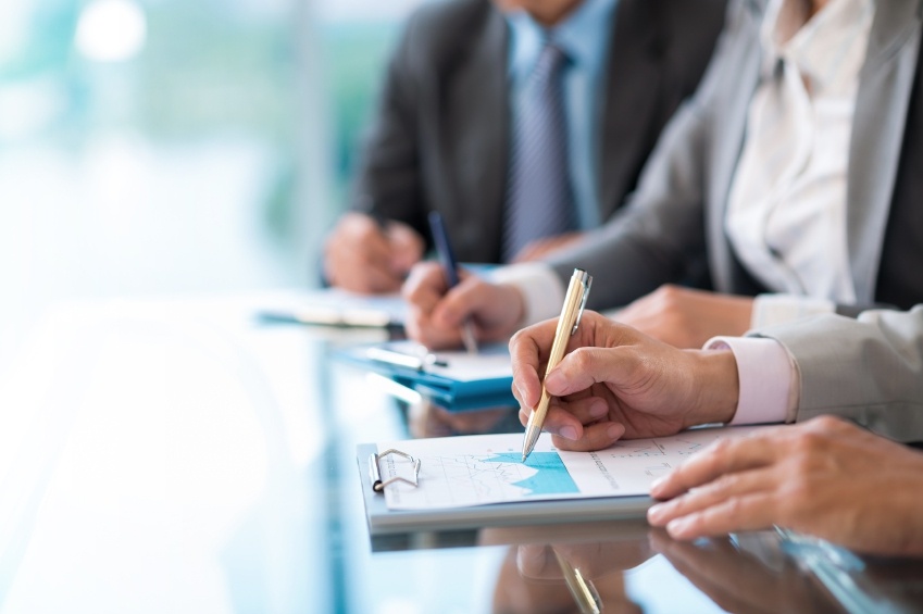 Business people working with financial report at the meeting, selective focus