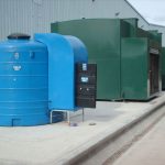 Fuel storage tank with Fuel filling stations in the background