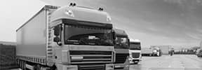 lorries in black and white using fuel management systems
