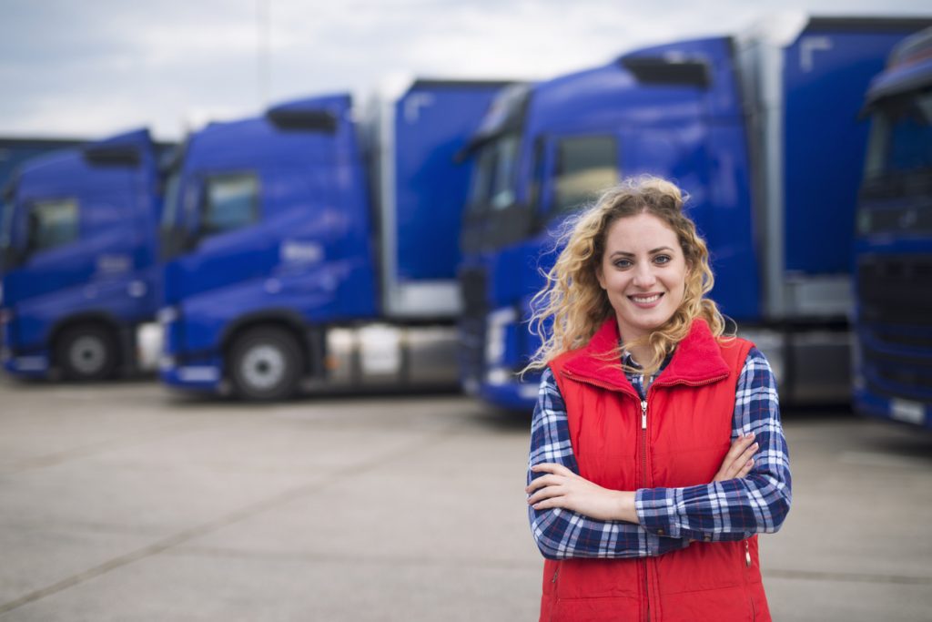 Truck driver occupation. Woman truck driver.