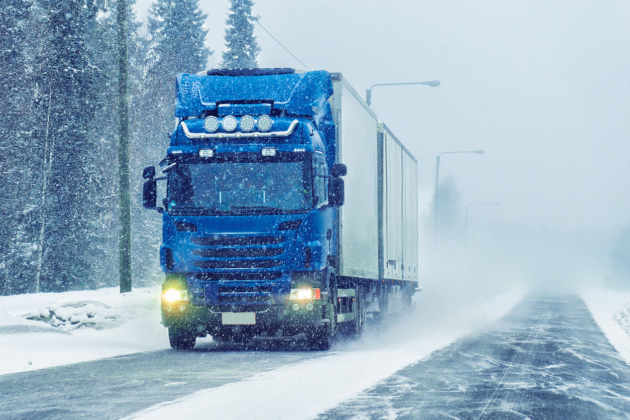 Van in the road of winter