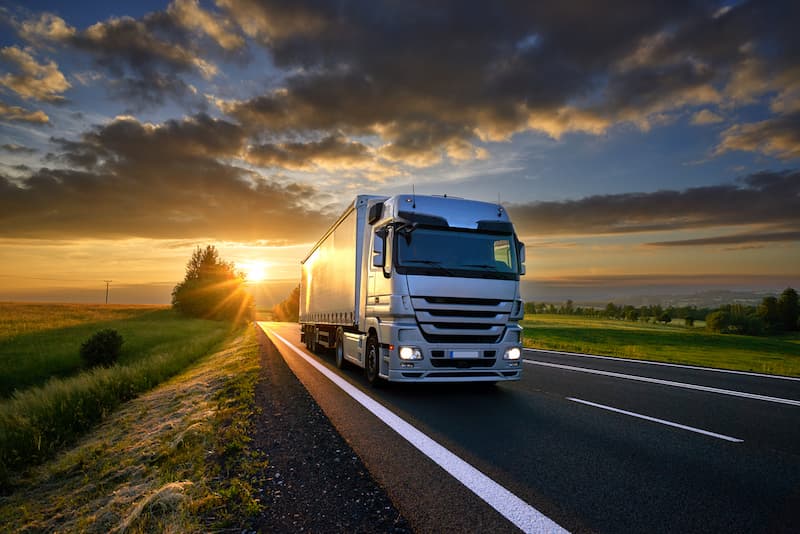 lorry driving at sunset
